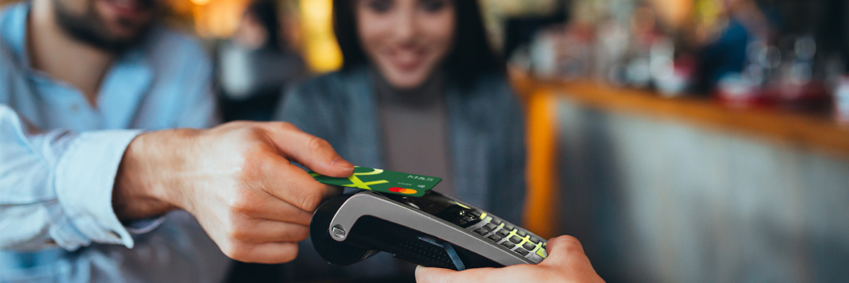 Couple making contactless payment