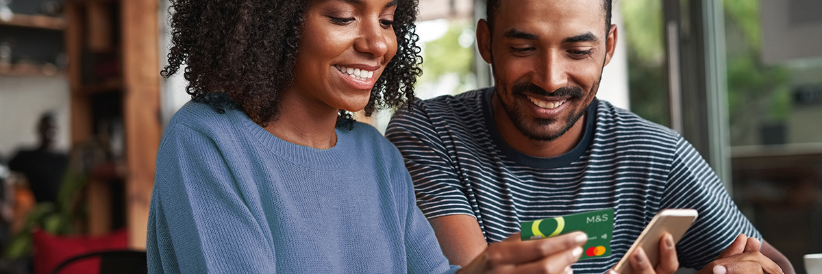Couple with Credit Card and phone