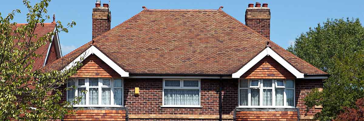 Front of a house showing windows and roof